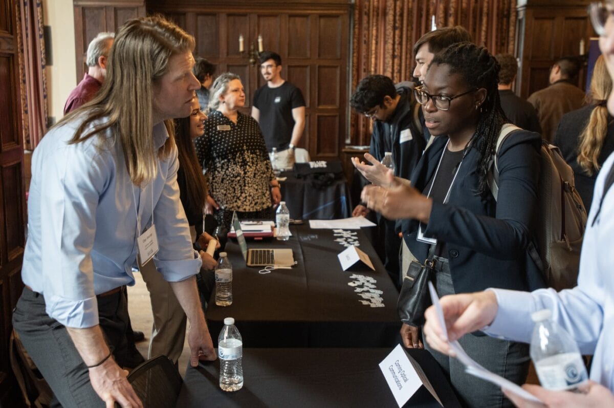 Attendee at the 2024 Chicago Quantum Recruiting Forum speaking with quantum professionals