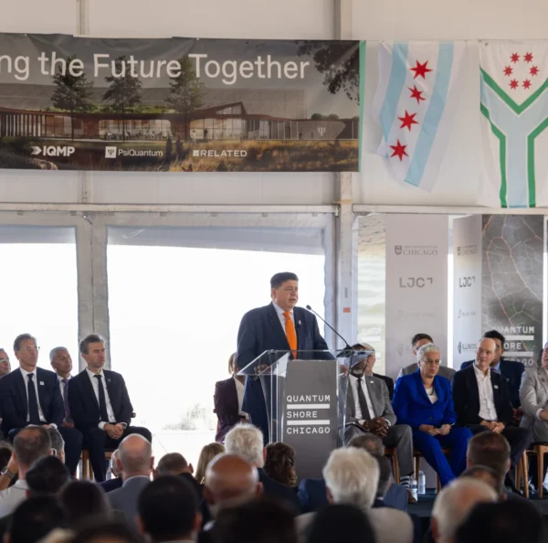 Governor Pritzker speaks on stage at the IQMP groundbreaking ceremony.