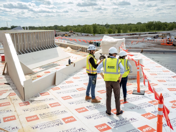 Harley Johnson, center, CEO of the Illinois Quantum and Microelectronics Park, at the site in Chicago.