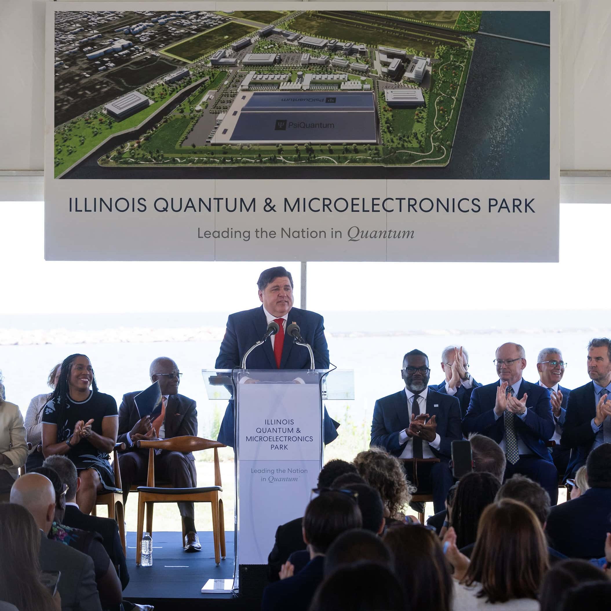 Announcement Gov. JB Pritzer announcing the IQMP at an event